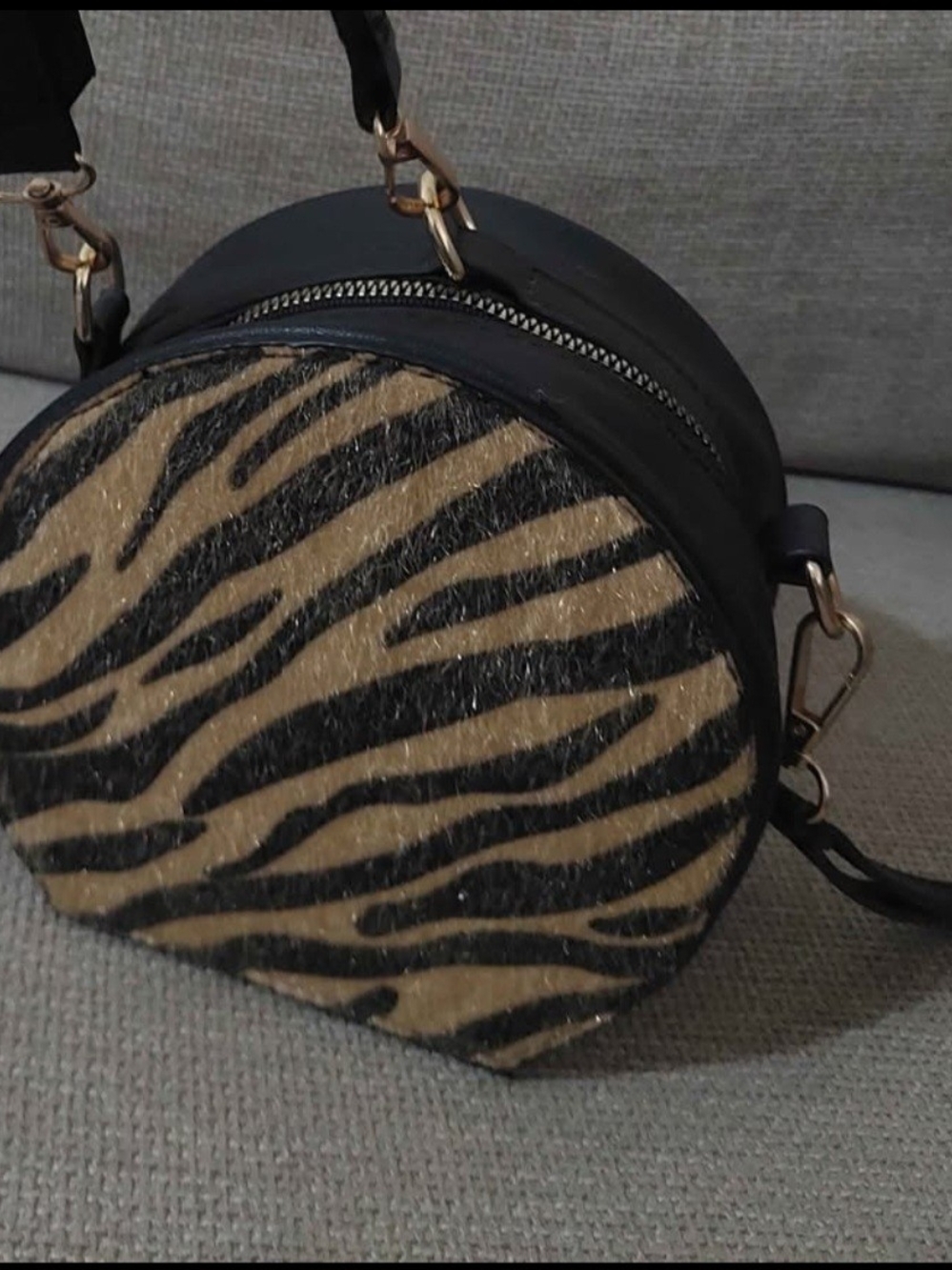 Zebra-Print Round Crossbody Bag in Black and Tan